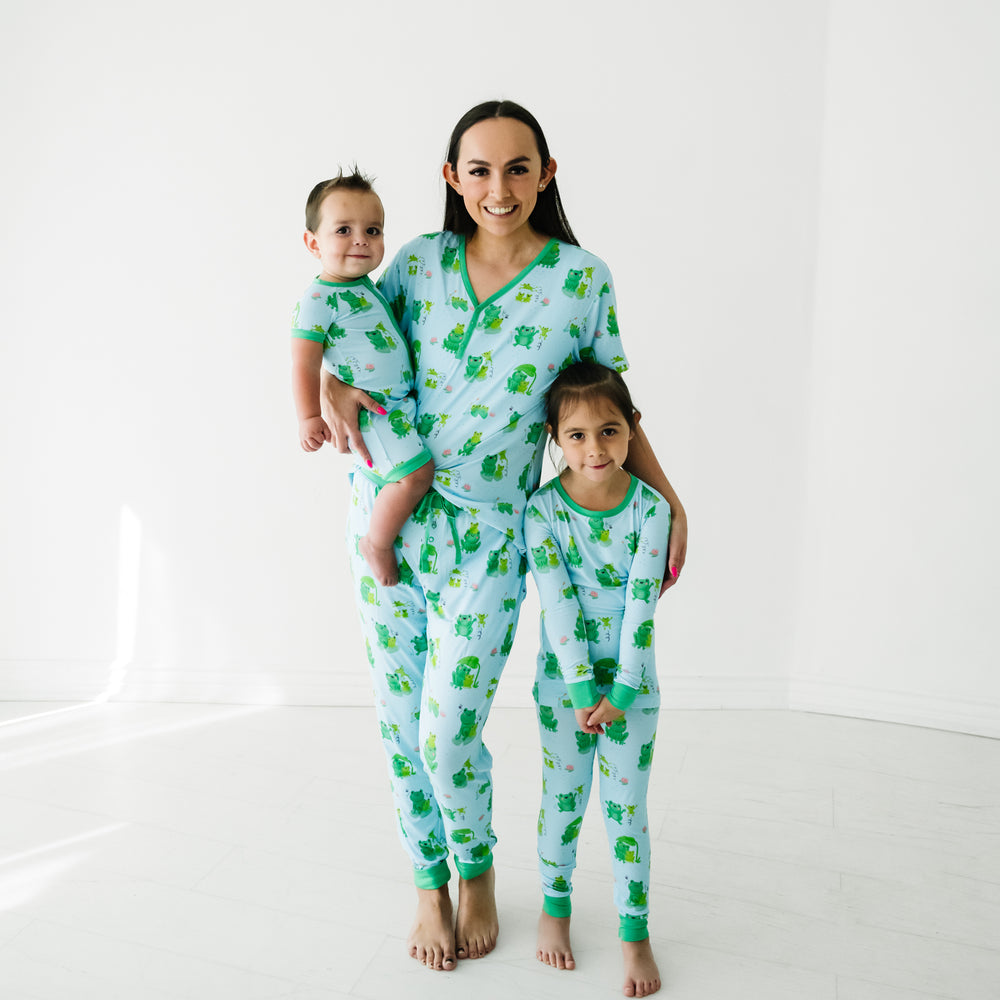 Mother and two children wearing matching Leaping Love pajamas