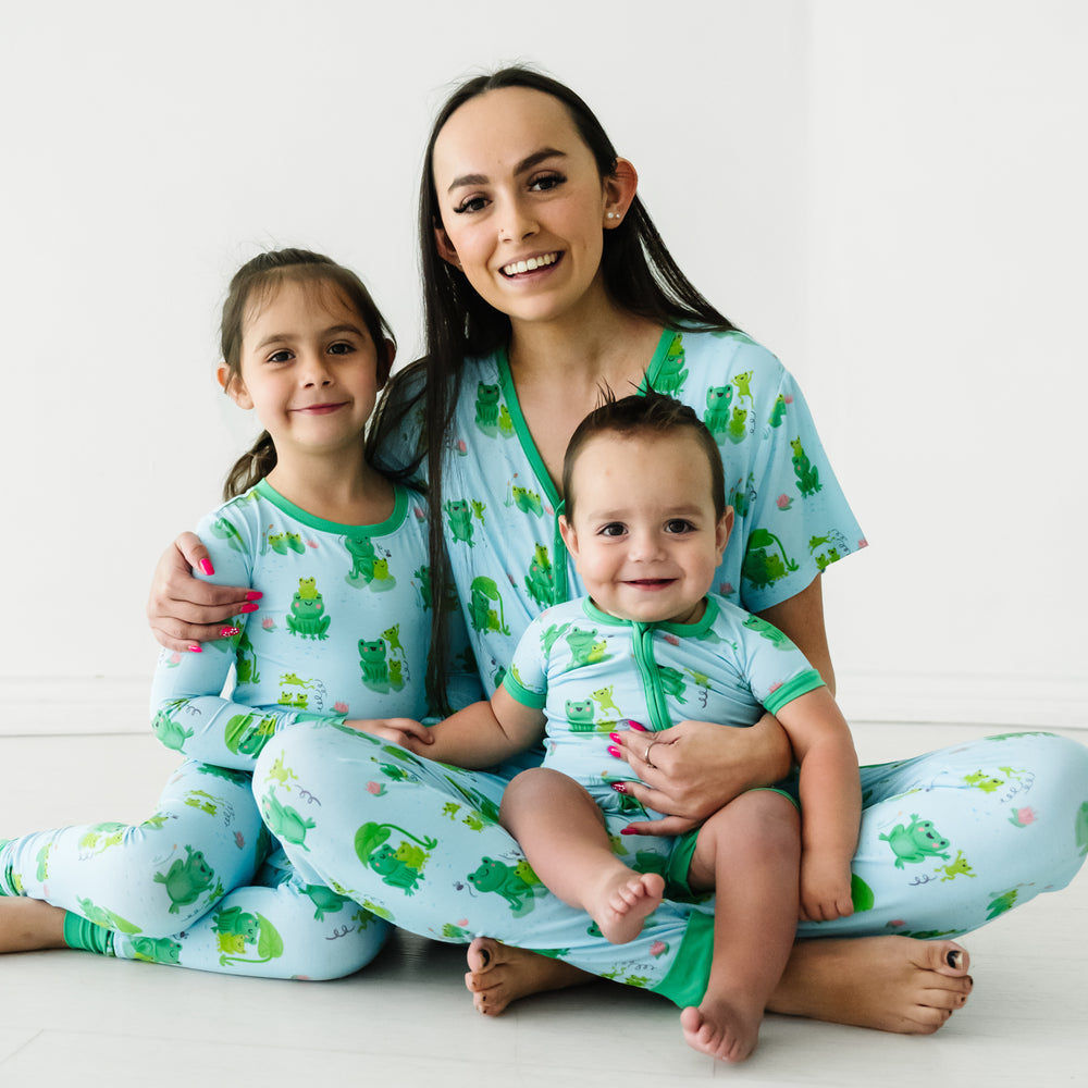 Mother and two children wearing matching Leaping Love pajamas