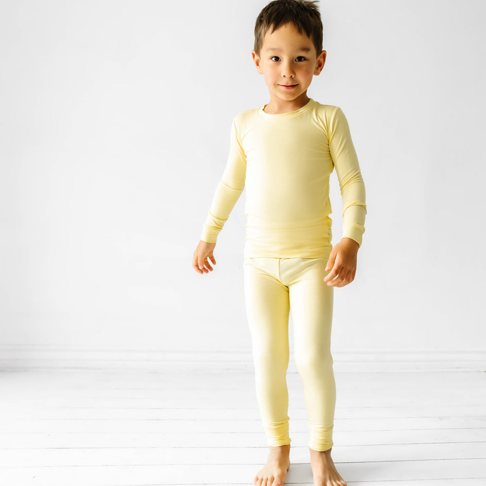 Child wearing a Lemon Twist two piece pajama set
