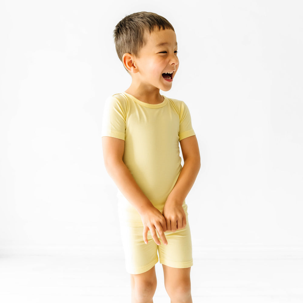 profile image of a child wearing a Lemon Twist two piece short sleeve and shorts pajama set