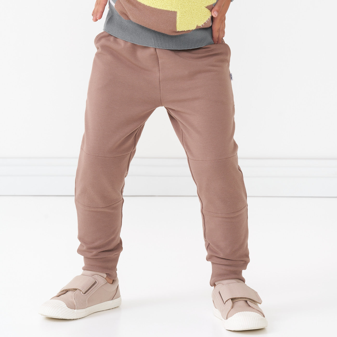 Close up image of a child wearing Light Cocoa joggers