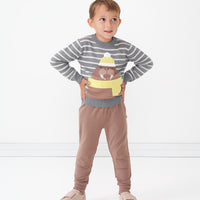 Child wearing Light Cocoa joggers and coordinating Walrus knit sweater
