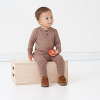 Alternate image of a child sitting on a box wearing a Light Cocoa henley tee and matching joggers