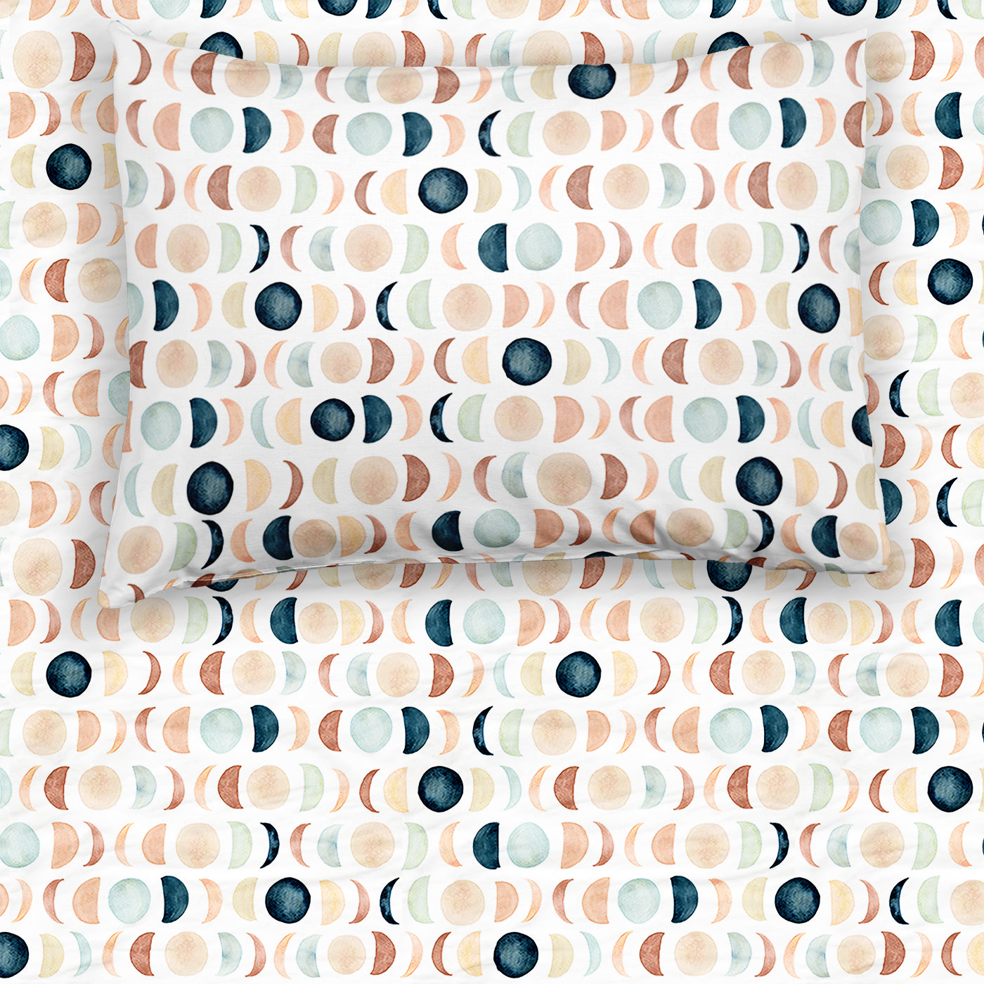 Flat lay image of a Luna Neutral fitted twin sheet with the matching pillowcase