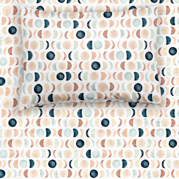 Flat lay image of a Luna Neutral fitted twin sheet with the matching pillowcase