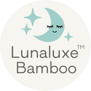 A circular badge with a blue sleeping crescent moon and text that reads 'Lunaluxe Bamboo'