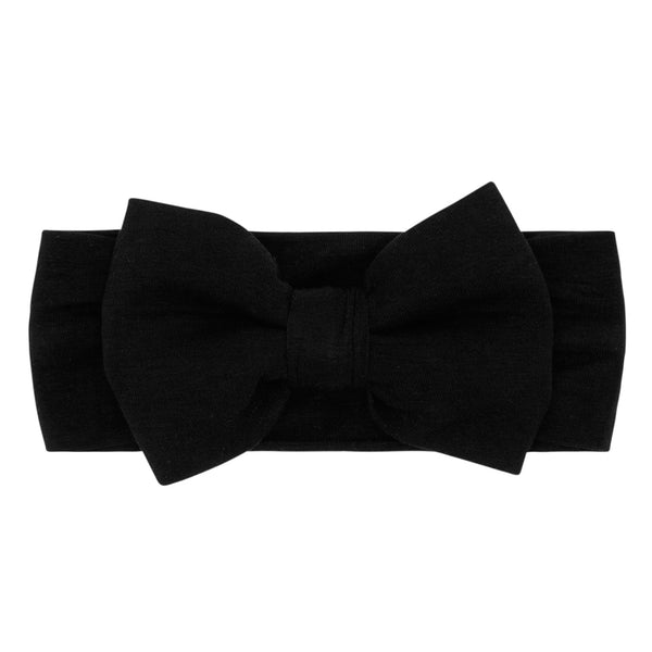 Flat lay image of the Black Luxe Bow Headband