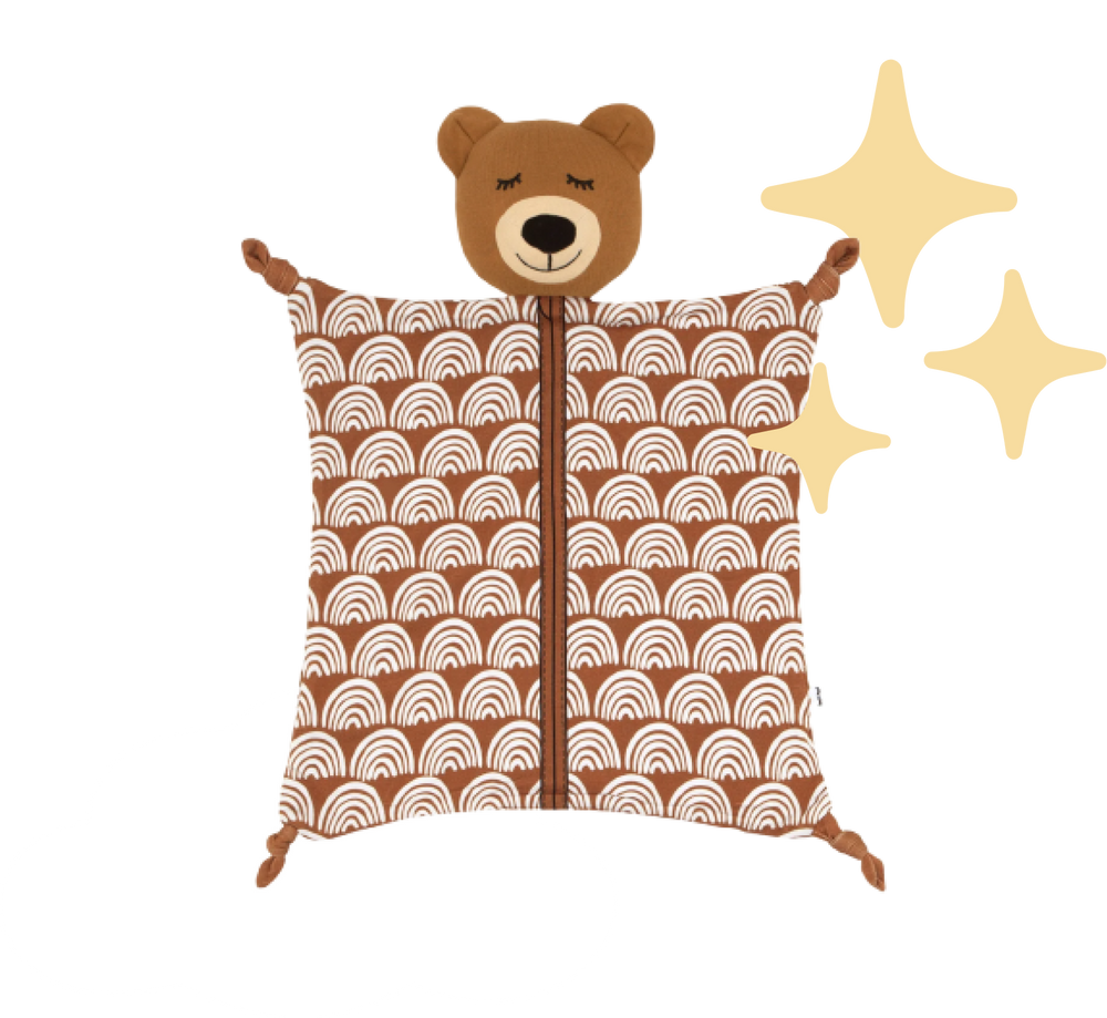 Flat lay image of Bowie the Bear surrounded by yellow stars and a white cloud