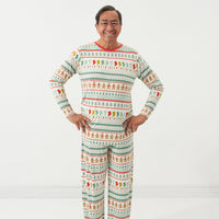 Man posing wearing a Fair Isle men's pajama top and matching men's pajama pants