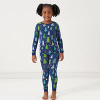 Child wearing a Blue Merry and Bright two piece pajama set