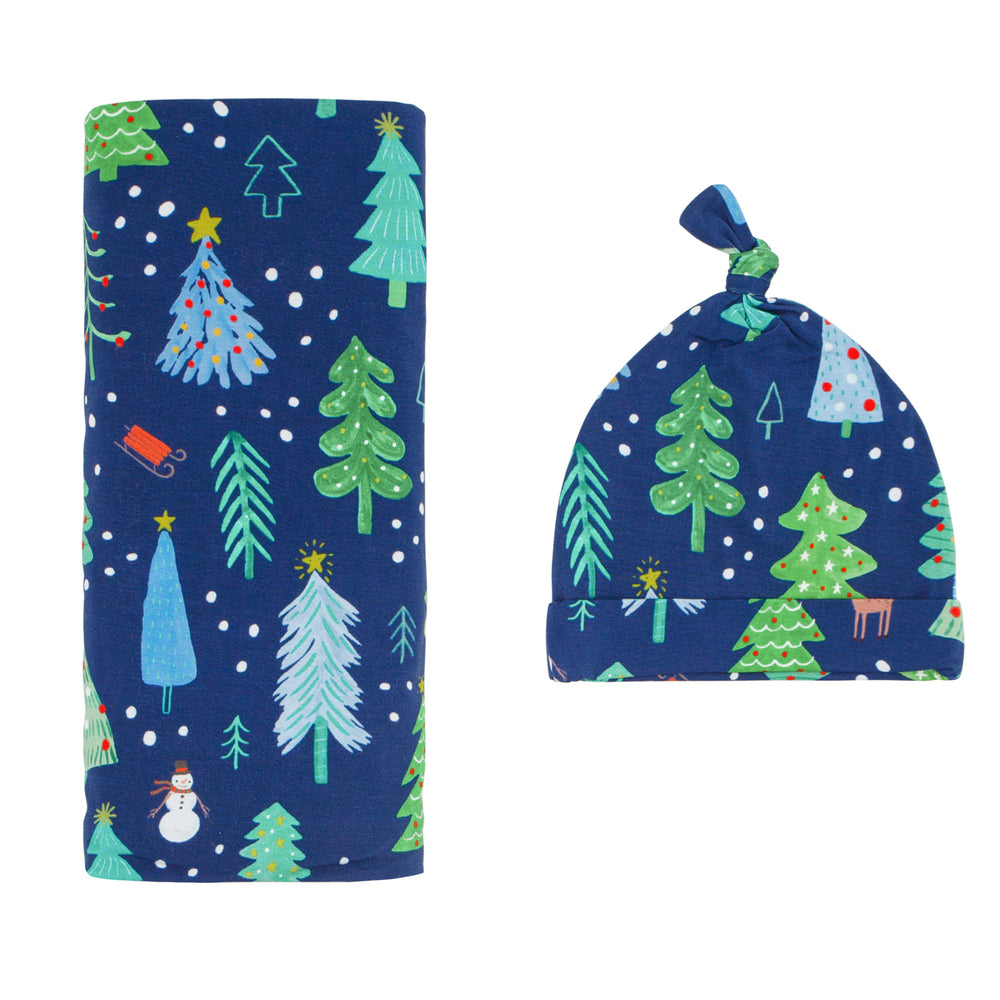 Flat lay image of Blue Merry and Bright swaddle and hat set