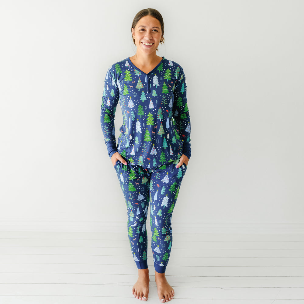 Woman wearing Blue Merry and Bright women's pajama top paired with matching women's pajama pants