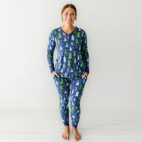 Woman wearing Blue Merry and Bright women's pajama top paired with matching women's pajama pants