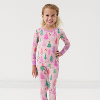 Child wearing Pink merry and bright two piece pajama set 