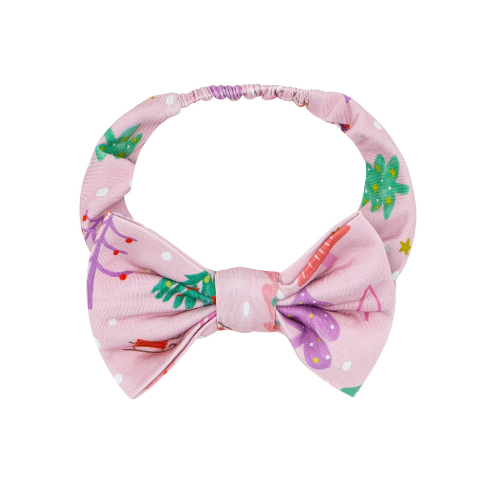 Flat lay image of Pink Merry and Bright luxe bow headband in size age 4 to age 8