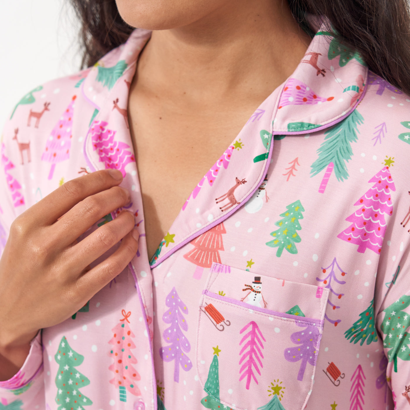 Close up detail image of a woman wearing a Pink Merry and Bright women's sleep shirt