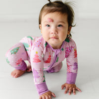 Child crawling wearing a Pink Merry and Bright Zippy