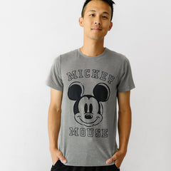 Man wearing Mickey collegiate men's graphic tee