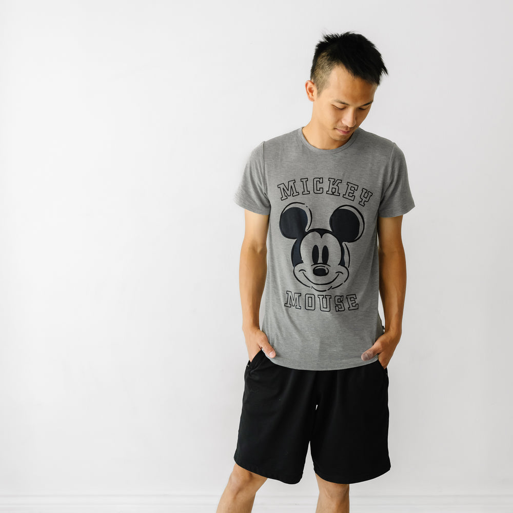 Click to see full screen - Alternate image of a man wearing a Mickey collegiate men's graphic tee