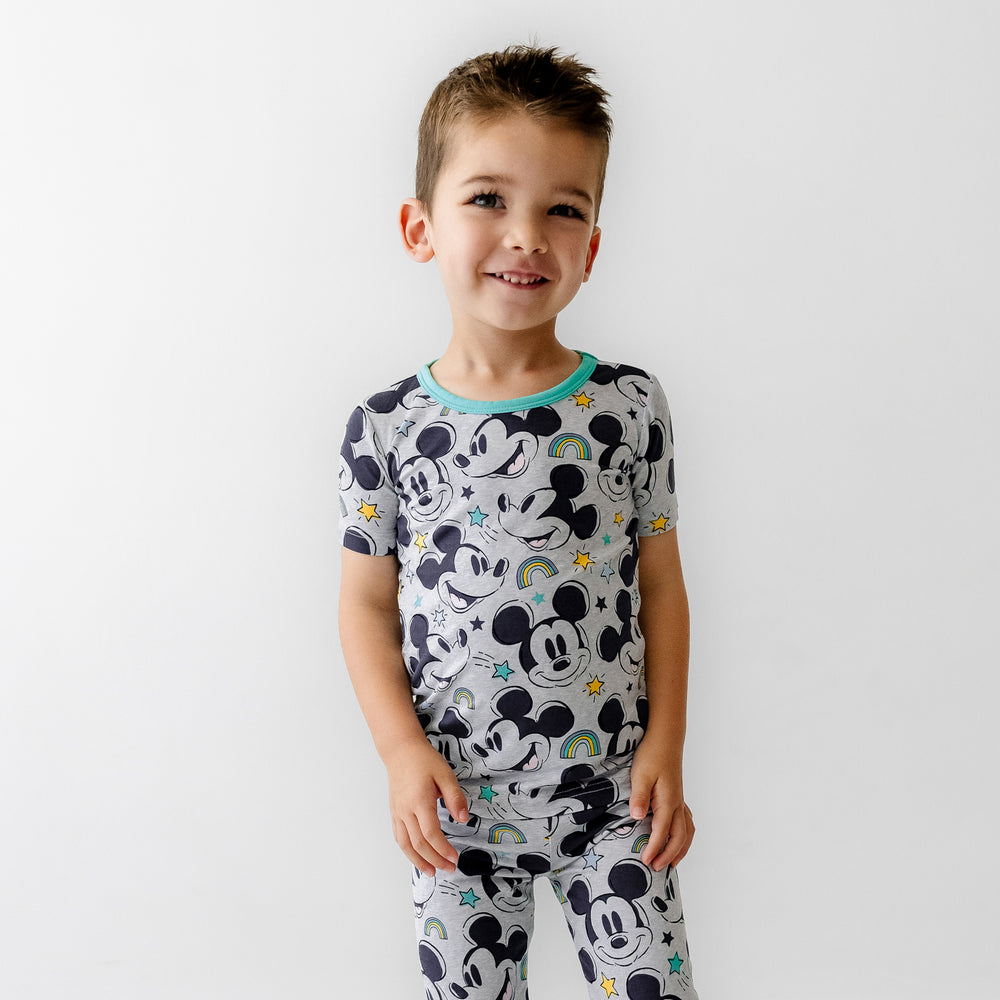 Click to see full screen - Close up image of a child wearing a Mickey Forever printed two piece short sleeve pajama set
