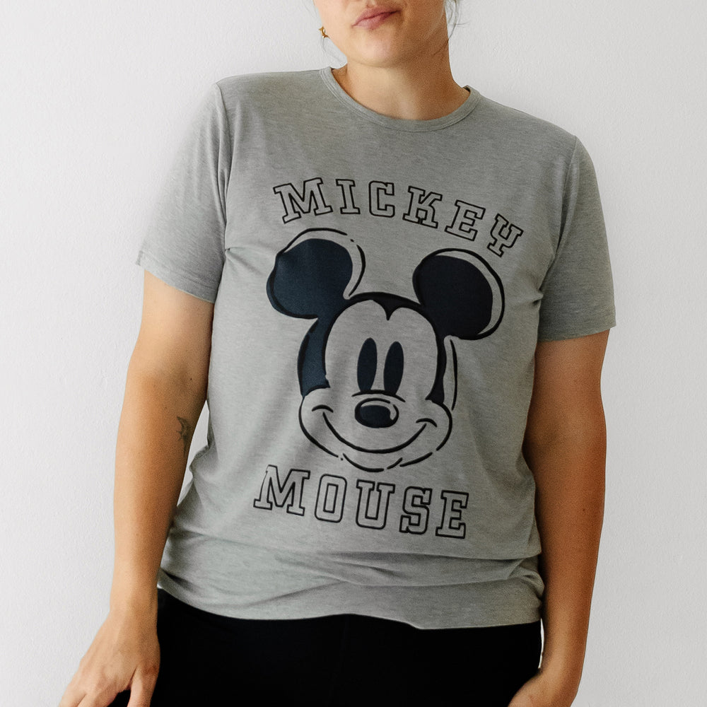 Close up image of a woman wearing a Mickey collegiate women's graphic tee