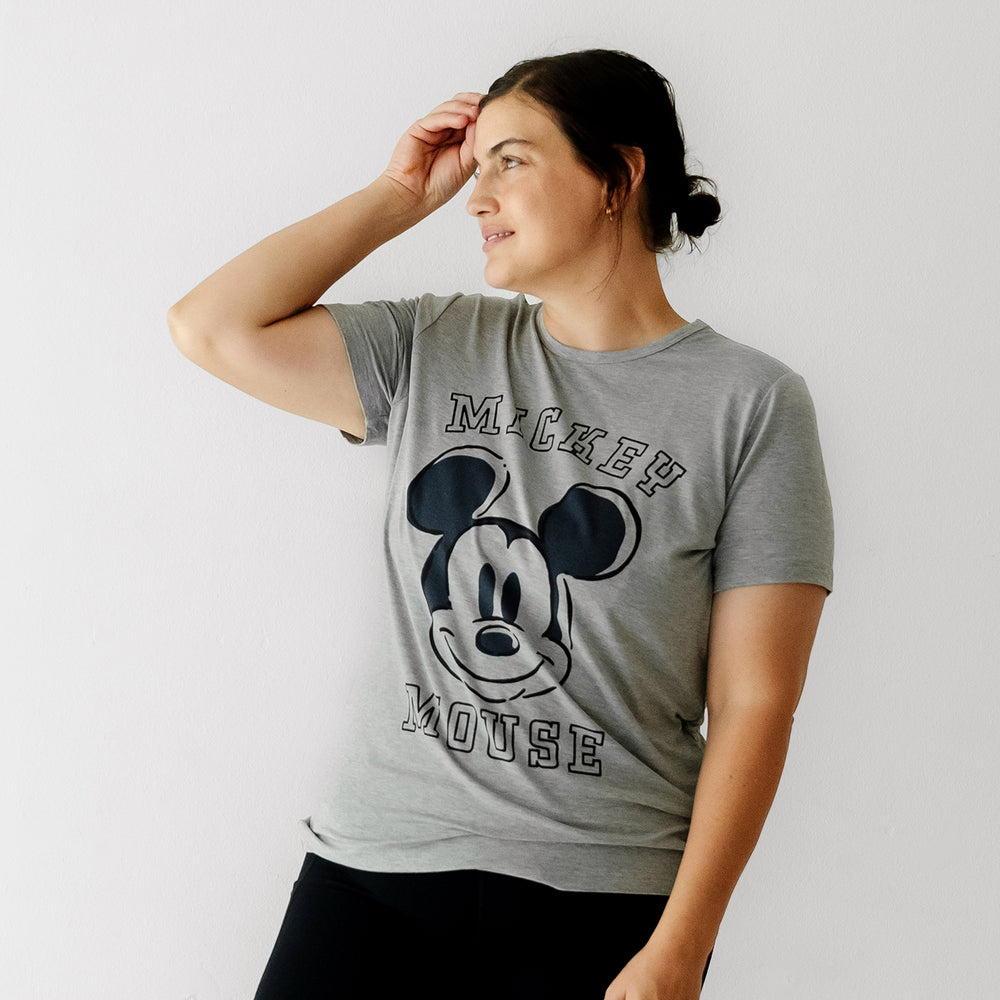 Alternate image of a woman looking off to the side wearing a Mickey collegiate women's graphic tee