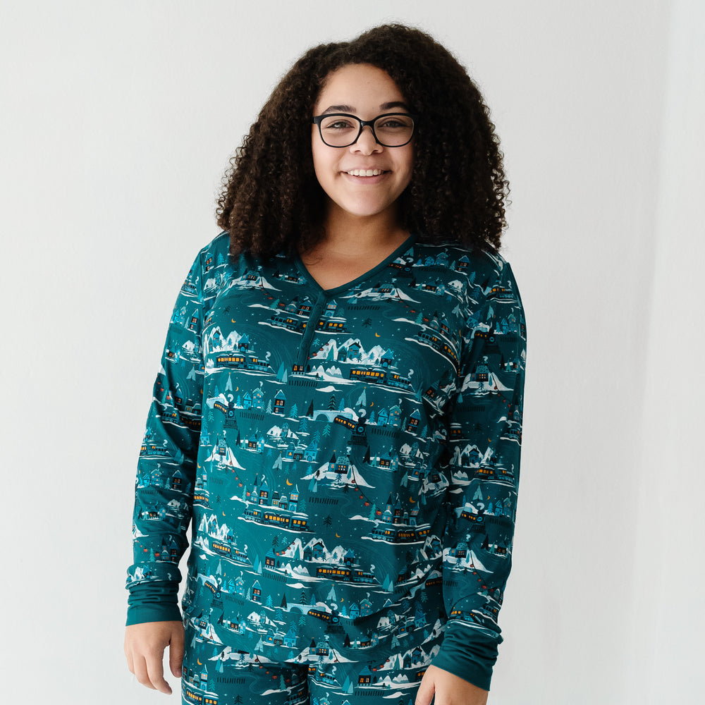 Woman wearing a Midnight Express women's pajama top paired with matching pajama pants