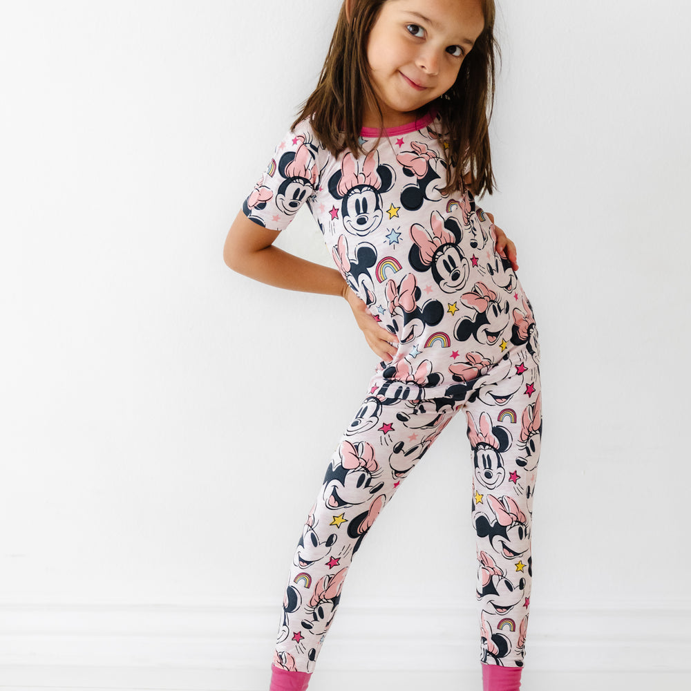 Child wearing a Minnie Forever printed two piece short sleeve pajama set