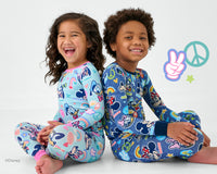 Two children wearing sibling matching pajamas in Disney Mickey's Clubhouse.