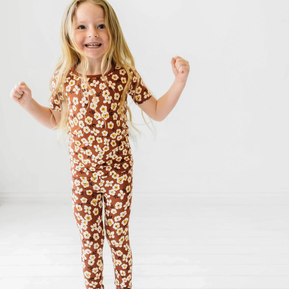 Child wearing a Mocha Blossom printed short sleeve pajama set
