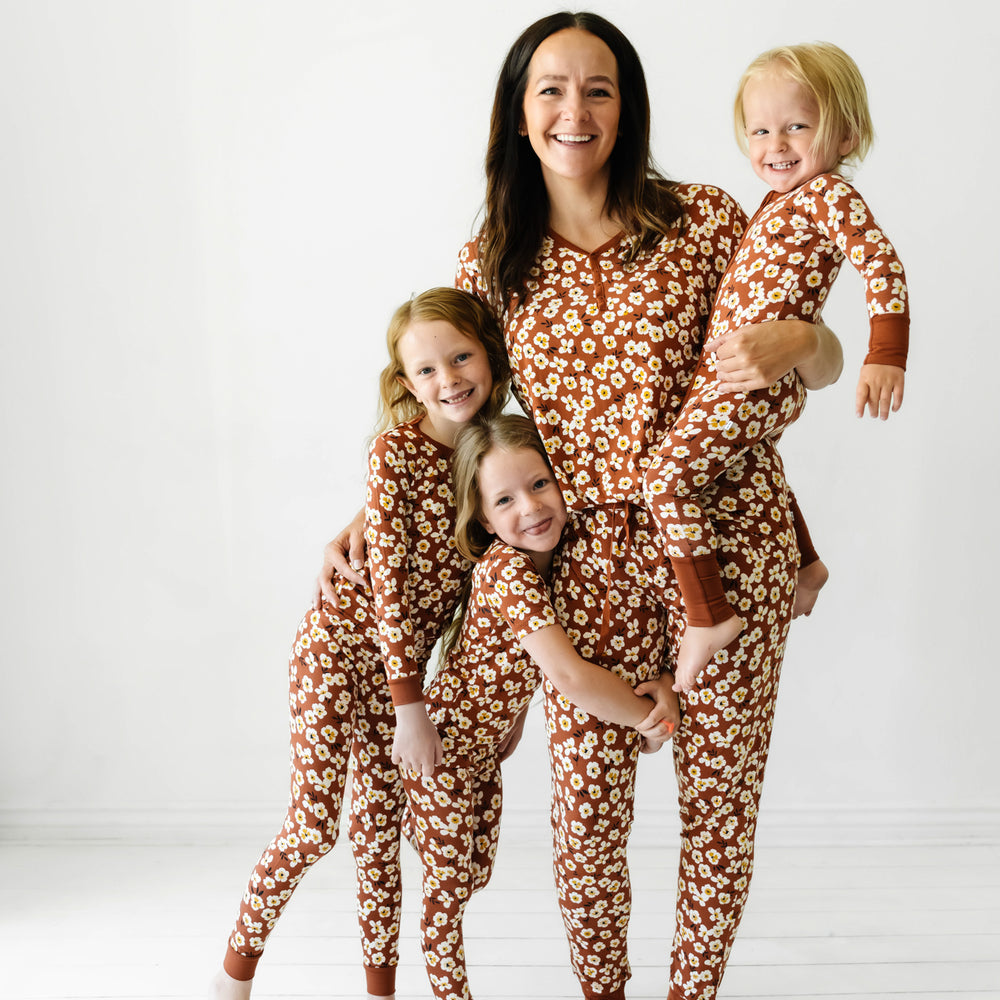 Click to see full screen - Family wearing matching Mocha Blossom printed pajamas