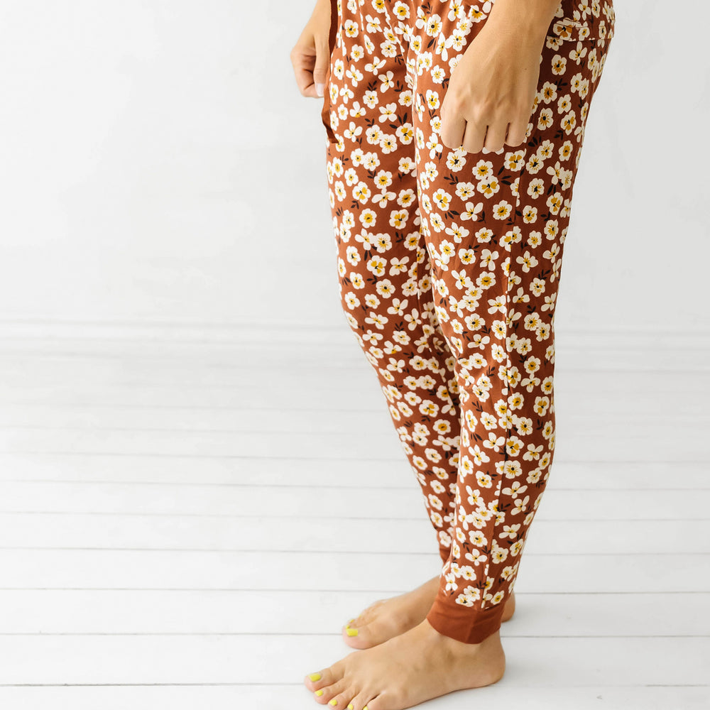 Side view image of a woman wearing Mocha Blossom printed women's pajama pants