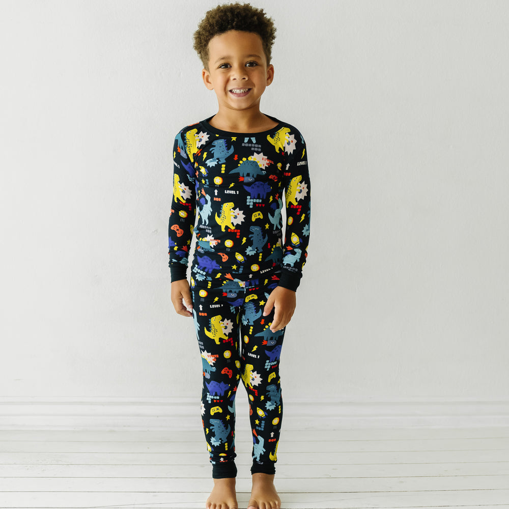Child wearing Next Level Dinos two piece pajama set