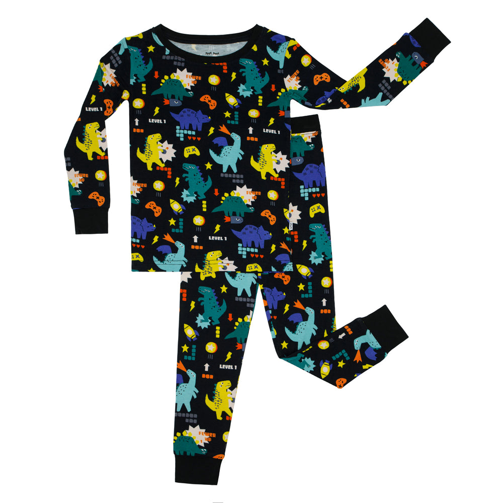 Flat lay image of Next Level Dinos two piece pajama set
