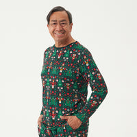 Close up image of a man wearing Night at the Nutcracker men's pajama top