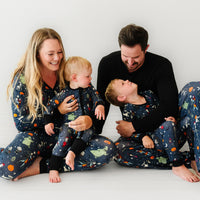 Family of four wearing matching Jack Skellington and Friends printed pajamas