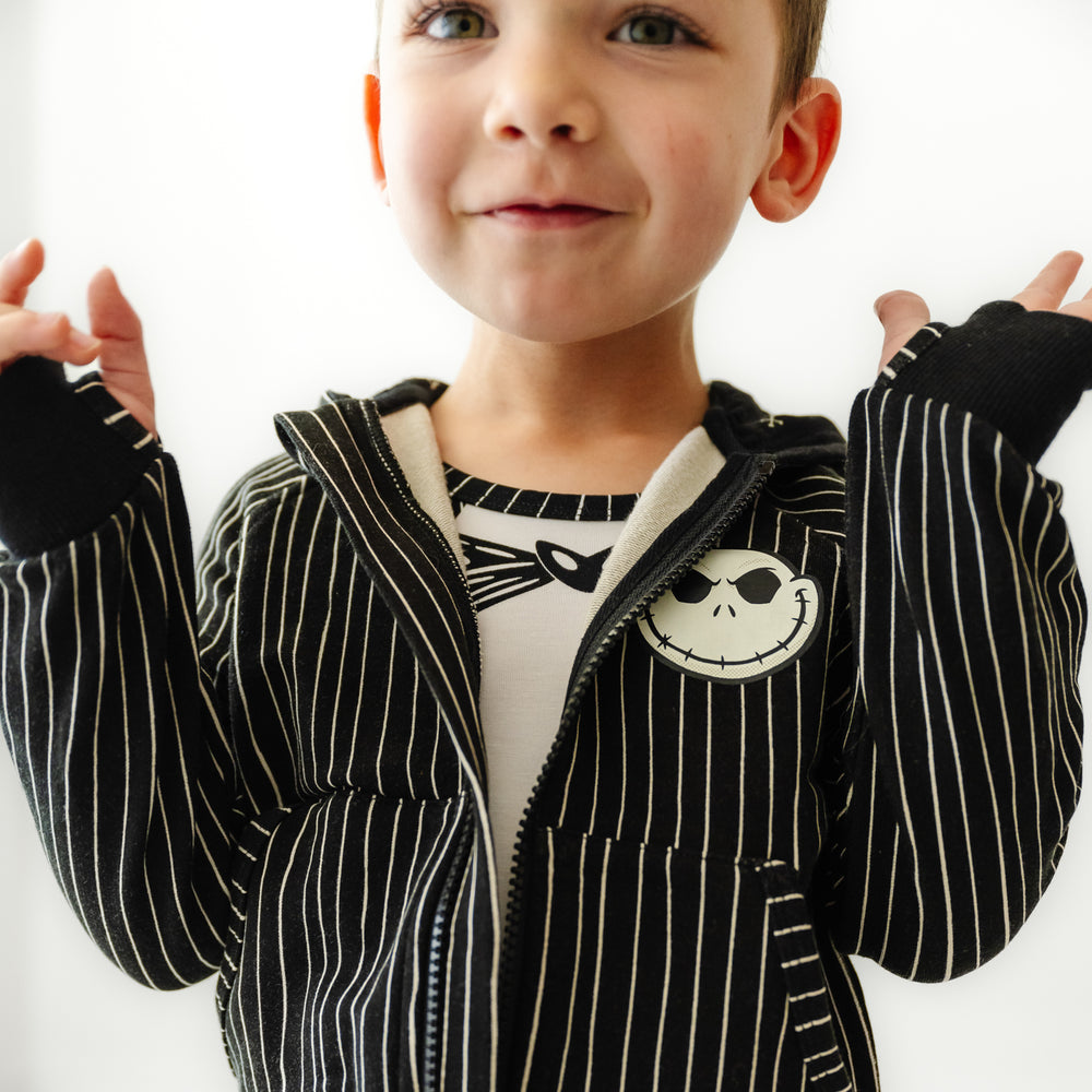 Close up image of a child wearing a Jack Skellington Zip Hoodie