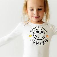 Close up image of a child wearing a Mama's Little Pumpkin graphic bodysuit