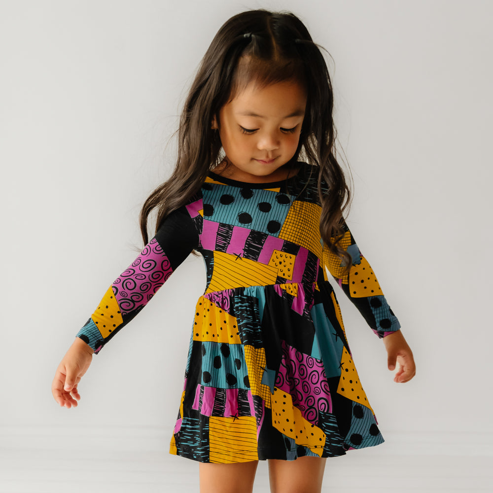 Alternate image of a child wearing a Sally's Patchwork twirl dress with bodysuit