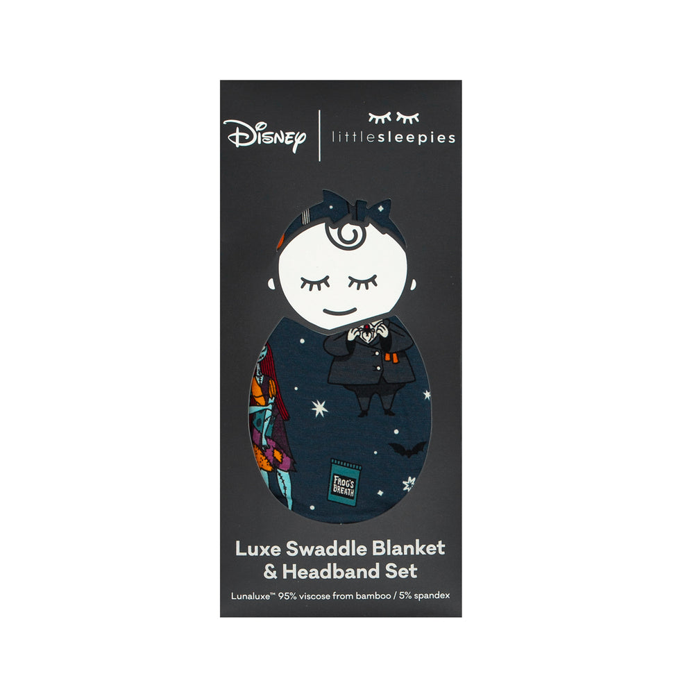 Flat lay of a Jack Skellington and Friends swaddle and luxe bow headband set in Little Sleepies peek-a-boo packaging