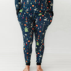 Close up image of a woman wearing Jack Skellington and Friends printed women's pajama pants