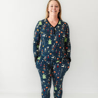 Woman wearing a Jack Skellington and Friends printed women's pajama top and matching pajama pants