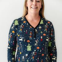 Close up image of a woman wearing a Jack Skellington and Friends printed women's pajama top
