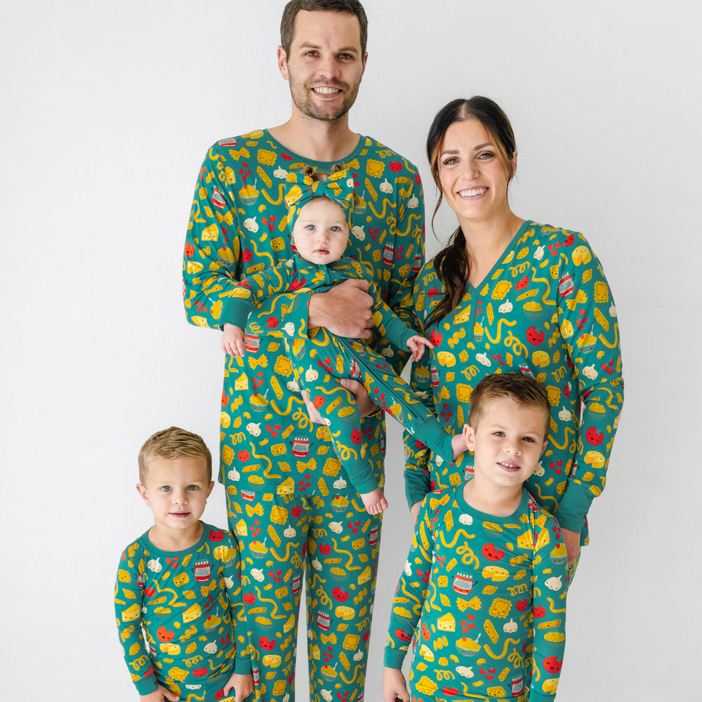 Click to see full screen - Family of five wearing matching Pasta Party pajamas