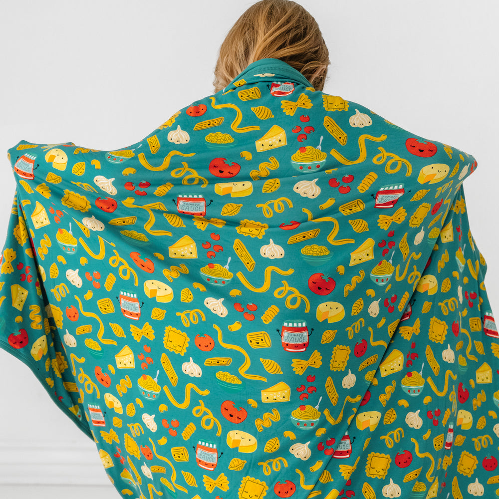 Click to see full screen - Back view image of a child with a Pasta Party large cloud blanket draped over them