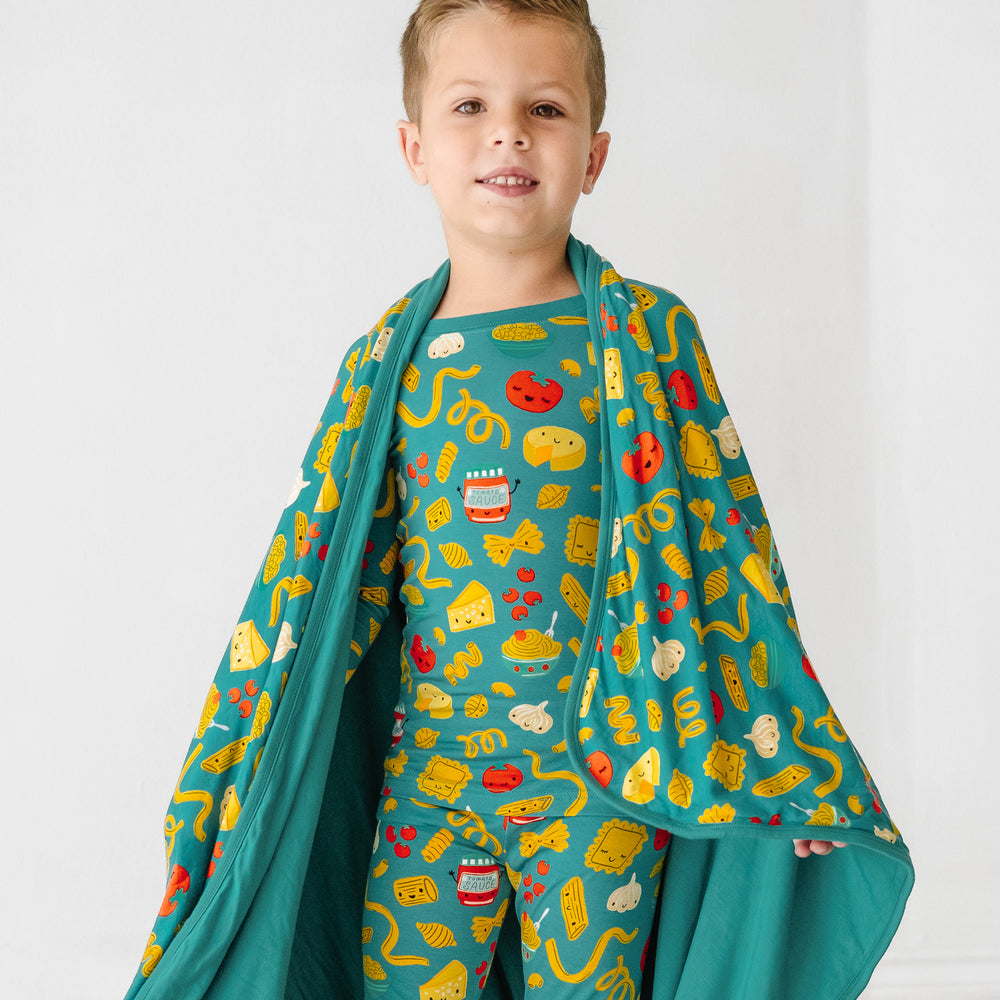 Click to see full screen - Alternate image of a child with a Pasta Party large cloud blanket draped over them and wearing matching pajamas