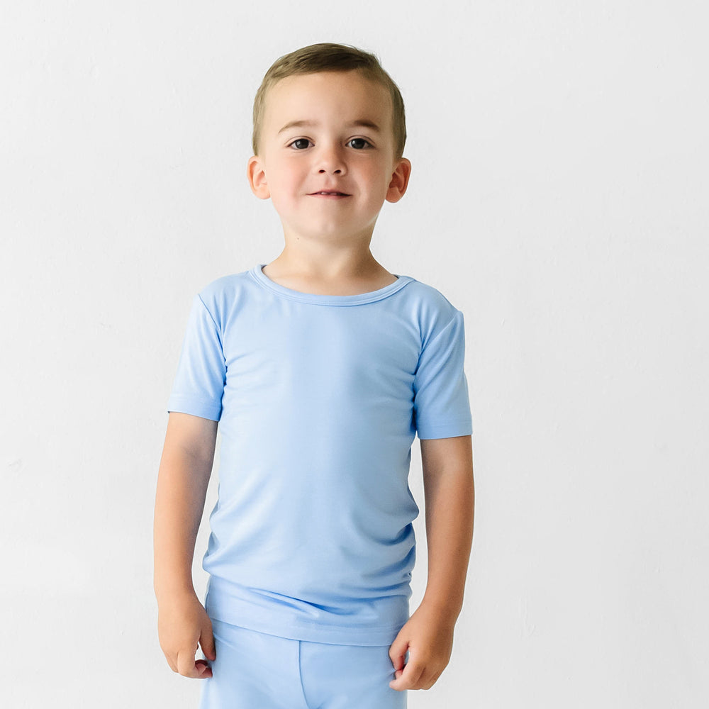 Child wearing a Periwinkle Blue two piece short sleeve and shorts pajama set