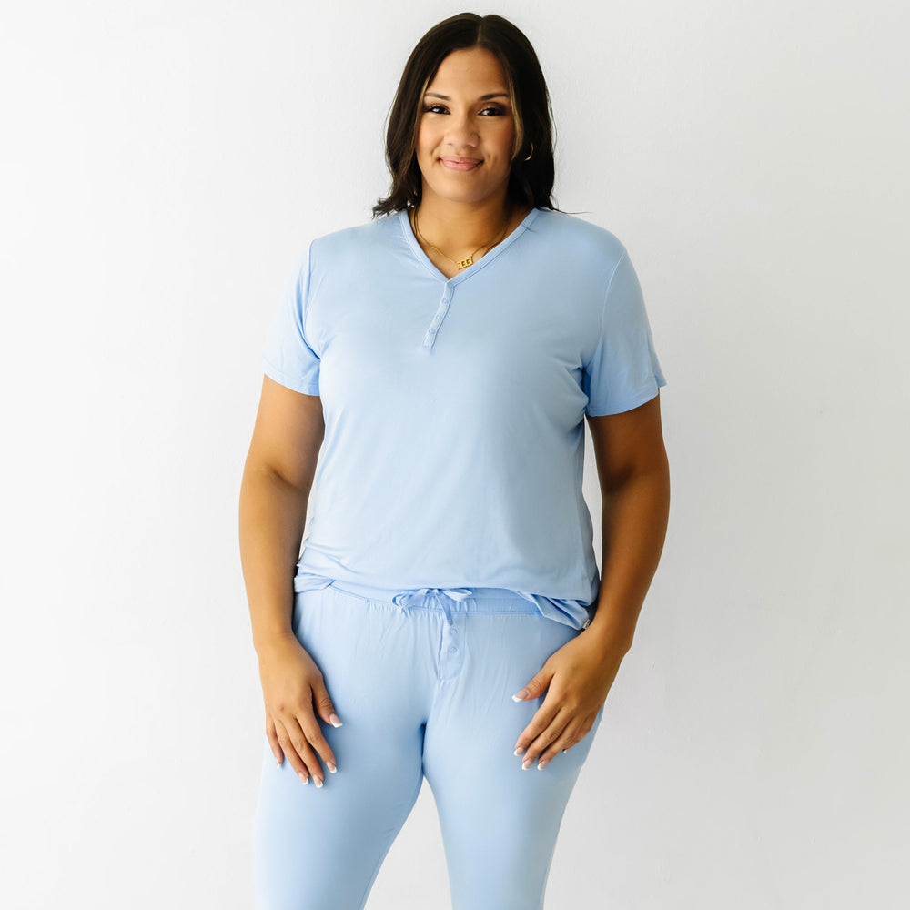 Woman posing wearing a women's Periwinkle Blue short sleeve pajama top and matching Periwinkle Blue women's pajama pants