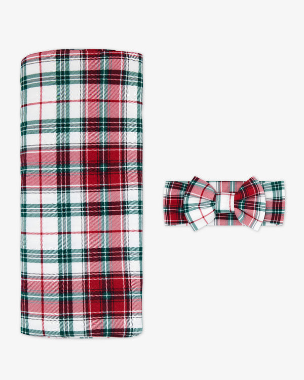 Flat lay of the Holly Plaid Swaddle & Luxe Bow Headband Set