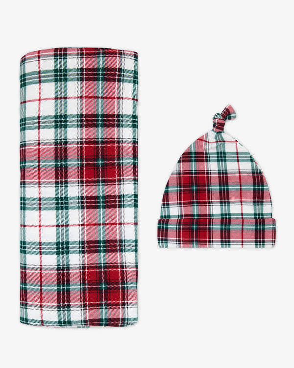 Flat lay of the Holly Plaid Swaddle & Hat Set